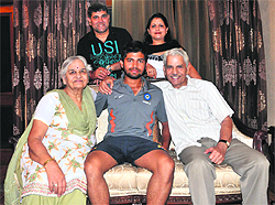 Manan Vohra (centre) with his family members at his house in Panchkula on Tuesday