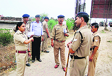 Circle officer Shah Jahan Khan gives instructions to police personnel ahead of the Kanwar fair in Haridwar on Tuesday. 