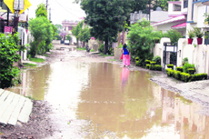 A water-logged street after rainfall in Puishpanjali enclave in Dehradun on Tuesday. 