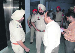 Police officials probe the death of a constable in the court complex in Amritsar on Wednesday.