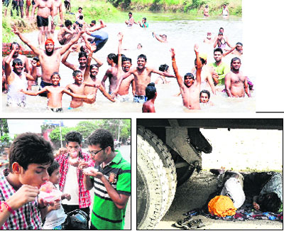  People bath in Sultanwind canal to get respite from the heatwave. Two persons sleep under a truck near Fatehgarh Churriyan bypass. Youths relish ice candies to beat the heat in Amritsar on Wednesday. 