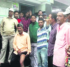 A man who was attacked by a rabid dog shows injury marks at Landour Bazaar in Mussoorie