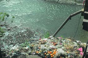 Garbage lying dumped into a nullah in Rajouri