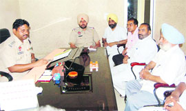 Police personnel at a meeting with municipal councillors in Jagraon on Wednesday.