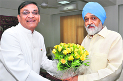 Associated Chambers of Commerce & Industry of India (Assocham) president Rajkumar Dhoot (L) called upon Planning Commission deputy chairman Montek Singh Ahluwalia at the latters office in New Delhi on Thursday. The apex industry body presented a seven-point agenda to boost the economys sentiment  Tribune photo