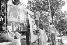 MC employees remove a hoarding from Phase I, Mohali, on Thursday