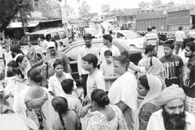 Residents block the Bassi-Ramgarh road at Dera Bassi on Thursday