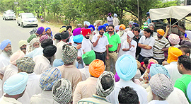 Farmers block traffic on the Ludhiana-Chandigarh road near Khamano on Thursday. 
