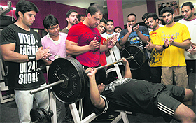 Members of the Prime Bodies Health Club participate in a bench press competition in Ludhiana on Thursday. 