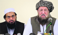 Maulana Samiul Haq (R), head of a coalition of hardline Islamist religious leaders and politicians with Hafiz Saeed at a press conference in Rawalpindi.  PTI