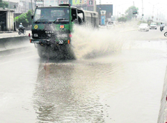 An Army truck passes through stagnant rainwater on the GT Road in Amritsar on Friday.