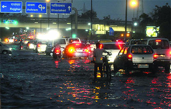 The evening downpour on Friday brought smiles on the faces of Delhiites though it also caused heavy traffic jams