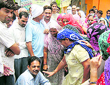 Villagers make Jeet Ram Sehlot, SDO, Electricity, sit in the sun outside his office on Friday