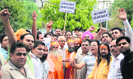 Activists of Jammu-Kashmir Bachao Manch hold a protest at the District Administrative Complex in Jalandhar on Friday. 