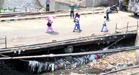 Main drainage of the city lying choked with polythene bags.