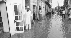 Rainwater enters houses at Palsora village in Sector 56, Chandigarh, on Saturday. 