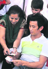 Baichung Bhutia gives an autograph to a fan in Chandigarh on Saturday.