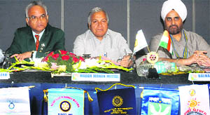 New Rotary Club president Balraj Singh Mejie (right) with Punjab Cabinet Minister Madan Mohan Mittal (centre) during the installation ceremony held at the CII, Sector 31, Chandigarh, on Saturday. 