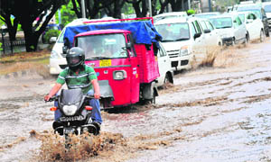 Vehicles wade through rainwater near Industrial Area, Phase II, Chandigarh, on Saturday.