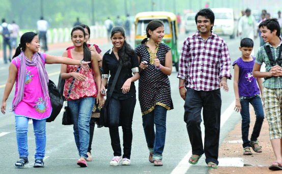 Youngsters enjoy the pleasant weather at the Rajpath in New Delhi on Saturday.