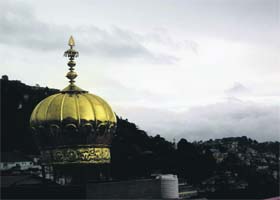 The golden mantle of a gurdwara shines after heavy rain in Mussoorie on Saturday