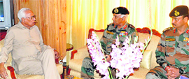 Governor NN Vohra talks to Lt Gen S Ravishankar, DG, BRO, and other officials in Srinagar on Saturday. 