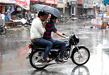 The rain gods finally smiled on the city early Sunday morning. The skies opened up and many were caught unawares (above) by the sudden downpour