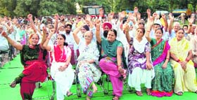 Members of the Chandigarh Housing Board Federation Association take part in a rally in support of their demands at Sector 37, Chandigarh, on Sunday