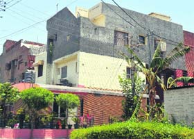A view of illegal structures constructed on the first and second floors by residents of the housing board colony at Sector 45 in Chandigarh