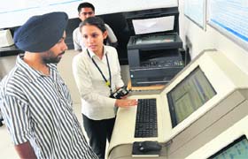 An employee helps an applicant with the procedure