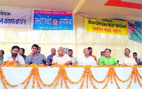 Speakers protest against the closure of a hydroelectric project in Srinagar on Sunday