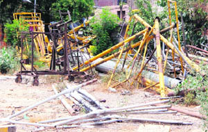 Expensive streetlights and electricity poles lying in a dumpyard in Amritsar.