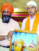 SGPC officials honour Priyank Bharti after he took over as officiating DC in Amritsar on Monday. 