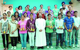 The students of St. Xaviers, who were felicitated for their good performance, along with the principal Father Eulalio Fernandes in Bathinda on Monday. 