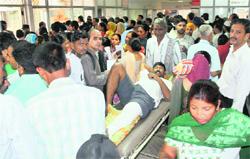 An attendant of a patient finds it hard to move a stretcher at the emergency wing of Government Multi-Speciality Hospital, Sector 16, in Chandigarh on Monday. Tribune Photo: Pradeep tewari