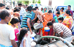 Residents fill their buckets from a water tanker at the diarrhoea-affected Vikas Nagar in Chandigarh on Monday. Tribune photo: Nitin Mittal