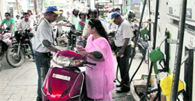 Long queues at a petrol station in Dehradun on Monday.