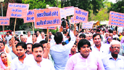 BJP activists hold a protest on the Kashmir issue in Gurgaon on Monday.
