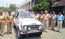 Kurukshetra district police chief Rakesh Kumar Arya (in front row) dedicates a van to policewomen at the district police headquarters. 