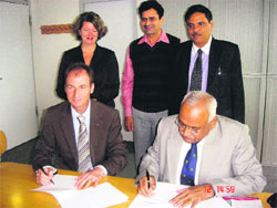 Vice-Chancellor of Murthal university HS Chahal (right) signs a memorandum of collaboration with the University of Applied Sciences, Detmold, Germany.