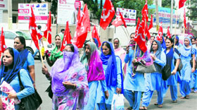 Members of the Accredited Social Health Activists Workers Union during a protest rally in Jammu on Monday.