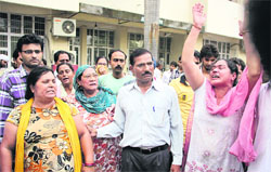 Family members of some of the accused in the Sunaina murder case protest outside the court