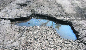 A pothole on the Khanna-Khamano road.