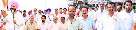 BJP MP Navjot Sidhu addresses a rally in Dasuya on Monday, the last day of canvassing, and (below) Congress candidate Arun Dogra (second from right) during his door-to-door campaigning. 