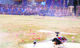 NCC cadets watch the functioning of a remote-controlled helicopter during a training camp in Amritsar on Tuesday. 