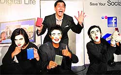 Seagate Technology senior VP & MD (Asia-Pacific & Japan) Banseng Teh with artistes displaying the firms new external storage devices at a press conference in New Delhi on Tuesday. The US-based tech major launched its reinvented Backup Plus for the portable 2.5-inch form factor that works silently to save and share content on social networks like Facebook and Flickr, and automatically backs up digital content