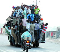 Thanks to increasing population, such overloaded public transport vehicles are a common sight on the city roads. 