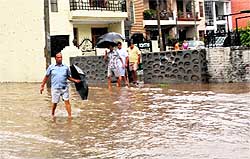 Residents face difficulty in rain at Phase-IV in Mohali on Tuesday