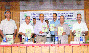 Dr AR Bhandari, former dean, College of Forestry, UHF, Nauni, Solan, releases a book on Crop Production under Changing Regional Climatic Scenario in Solan District during a workshop on climate change. 