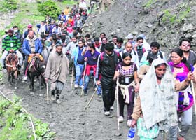 Devotees on their way to the Amarnath cave shrine, some 130 km south of Srinagar, on Tuesday